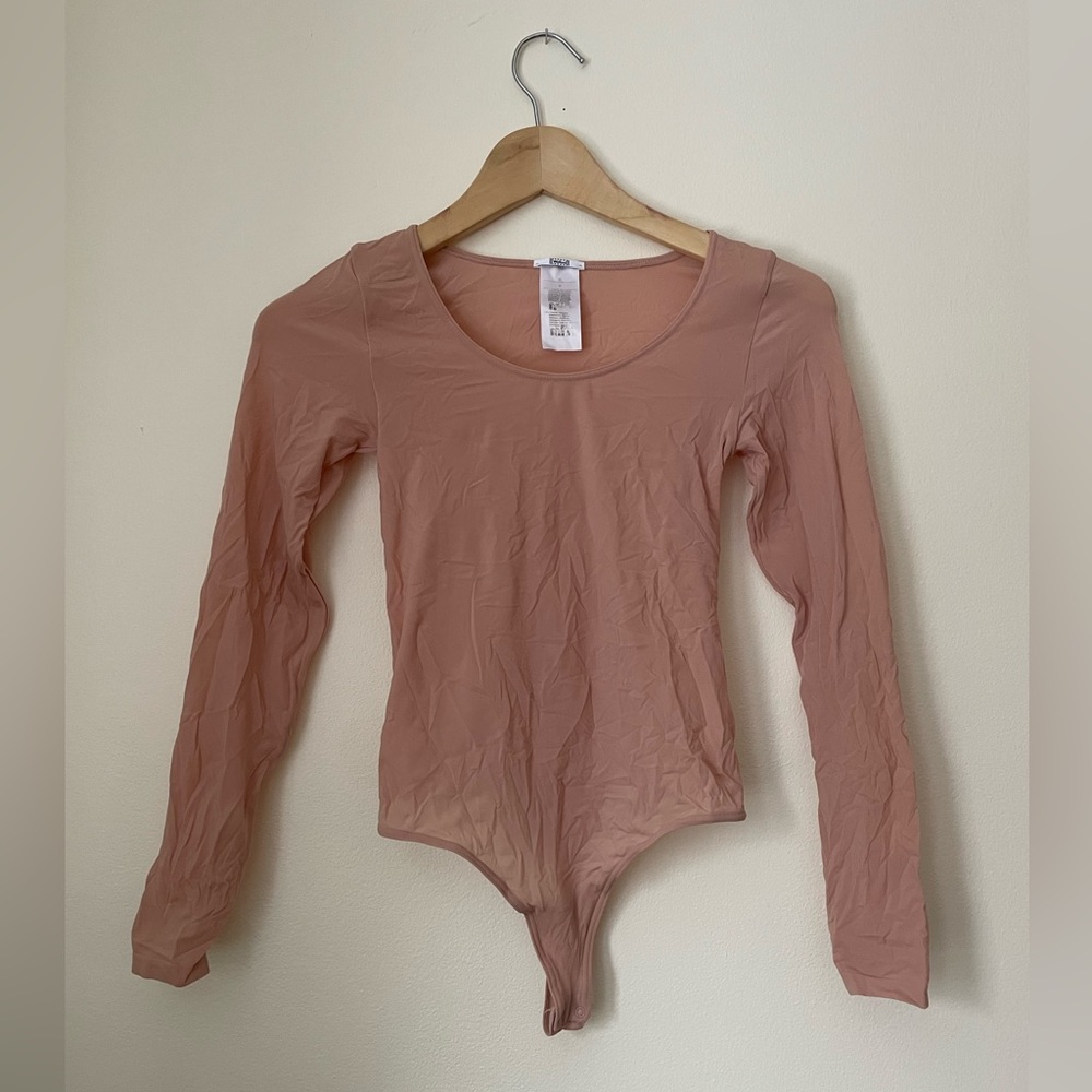 Sheer pink Wolford bodysuit